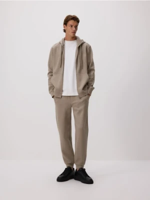 Reserved - Dresowe spodnie jogger z bawełną - brązowy
