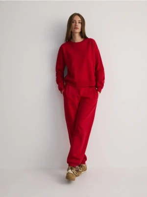 Reserved - Dresowe spodnie jogger z bawełną - czerwony