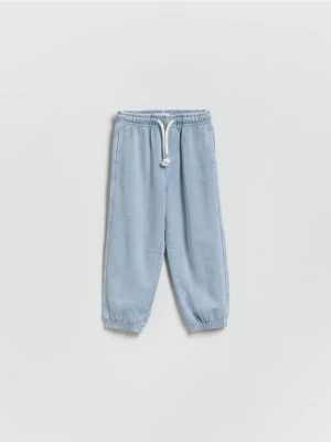 Reserved - Dresowe spodnie z efektem sprania - jasnoniebieski