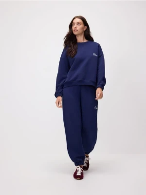Reserved - Dresowe spodnie z haftem - granatowy