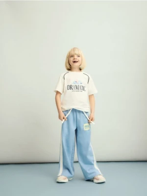 Reserved - Dresowe spodnie z lampasem - niebieski