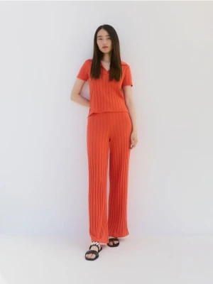 Reserved - Dzianinowe spodnie - pomarańczowy