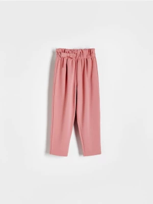 Reserved - Dzianinowe spodnie z kokardką - Różowy