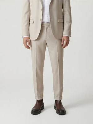 Reserved - Garniturowe spodnie w kant - beżowy