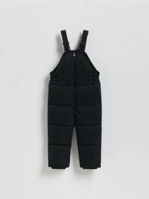 Reserved - Gumowane spodnie na szelkach - czarny