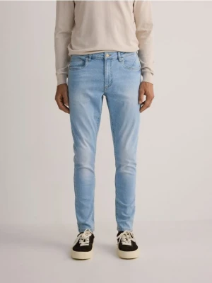 Reserved - Jeansy skinny z efektem sprania - niebieski