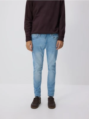 Reserved - Jeansy skinny z efektem sprania - niebieski