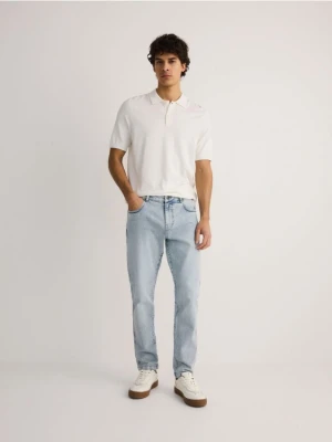 Zdjęcie produktu Reserved - Jeansy slim z efektem sprania - niebieski