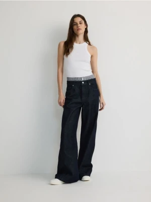 Reserved - Jeansy wide leg z ozdobną wstawką - granatowy