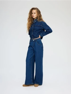 Reserved - Jeansy wide leg z ozdobnymi kieszeniami - niebieski