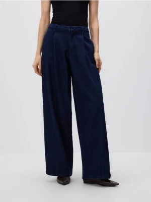 Reserved - Jeansy wide leg z zakładkami - granatowy