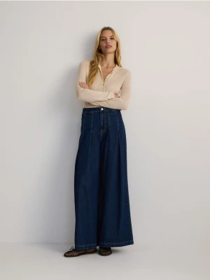 Reserved - Jeansy wide leg z zakładkami - granatowy