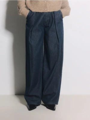 Reserved - Jeansy wide leg z zakładkami - granatowy