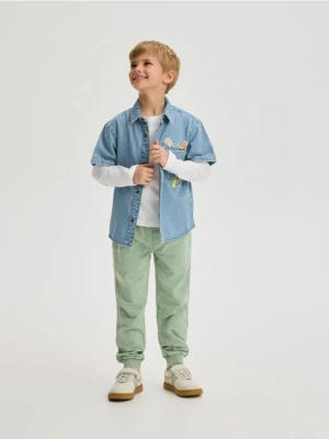 Reserved - Joggery z efektem sprania - jasnozielony