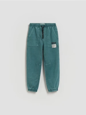 Reserved - Joggery z efektem sprania - morski