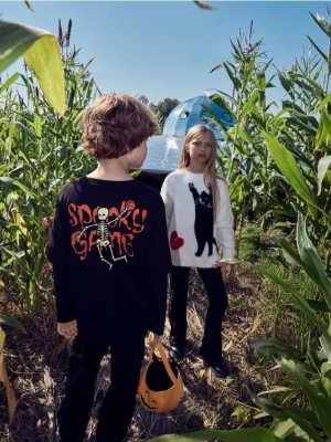 Zdjęcie produktu Reserved - Longsleeve z nadrukiem świecącym w ciemności - czarny