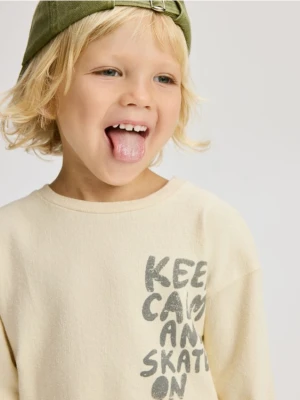 Reserved - Longsleeve z nadrukiem - złamana biel