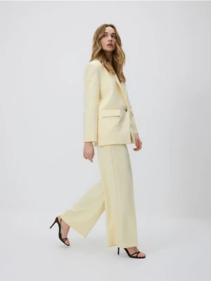 Reserved - Luźne spodnie - jasnożółty