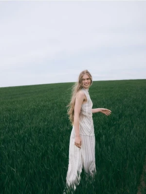 Reserved - Luźne spodnie z metalizowaną nitką - beżowy