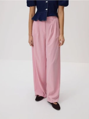Reserved - Luźne spodnie z zakładkami - pastelowy róż