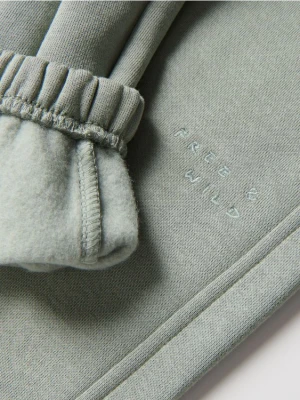 Reserved - Ocieplane spodnie jogger - jasnozielony