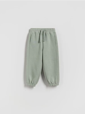 Reserved - Ocieplane spodnie jogger - jasnozielony