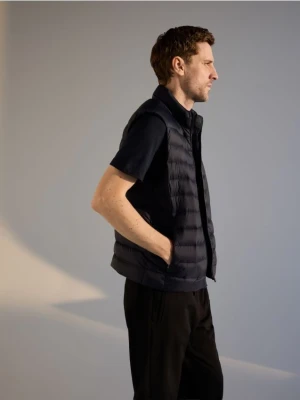 Reserved - Pikowana kamizelka z naturalnym puchem - granatowy