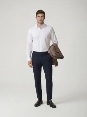 Reserved - Spodnie chino slim fit - granatowy
