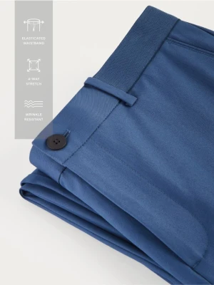 Reserved - Spodnie chino slim fit - niebieski