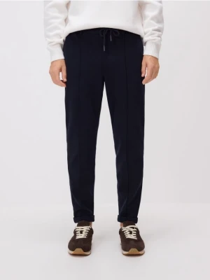 Reserved - Spodnie chino slim - granatowy