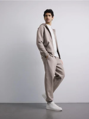 Reserved - Spodnie dresowe comfort fit - beżowy