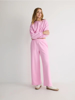 Reserved - Spodnie dresowe - jasnopomarańczowy