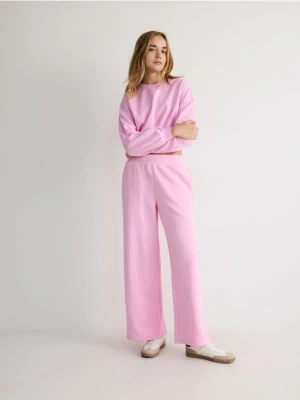 Reserved - Spodnie dresowe - jasnopomarańczowy