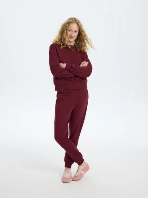 Reserved - Spodnie dresowe jogger z bawełną - bordowy