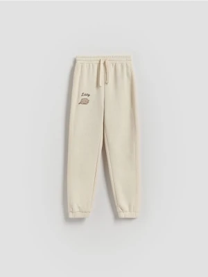 Reserved - Spodnie dresowe Pusheen - beżowy