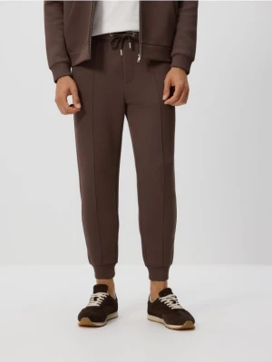 Reserved - Spodnie dresowe slim fit - beżowy