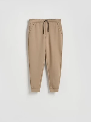 Reserved - Spodnie dresowe slim fit - beżowy