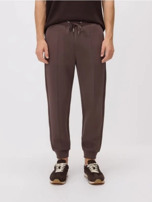 Reserved - Spodnie dresowe slim fit - beżowy