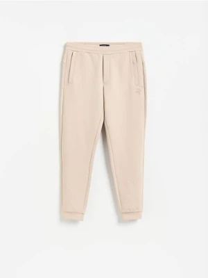 Reserved - Spodnie dresowe slim fit - beżowy