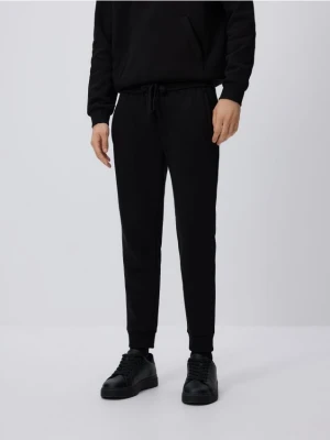 Reserved - Spodnie dresowe slim fit - czarny