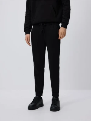 Reserved - Spodnie dresowe slim fit - czarny