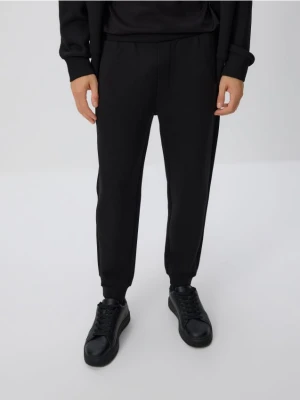 Reserved - Spodnie dresowe slim fit - czarny