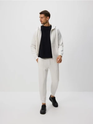 Reserved - Spodnie dresowe slim fit - złamana biel