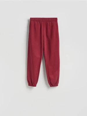Reserved - Spodnie dresowe z bawełną - bordowy