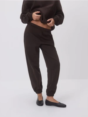 Reserved - Spodnie dresowe z bawełną - ciemnobrązowy