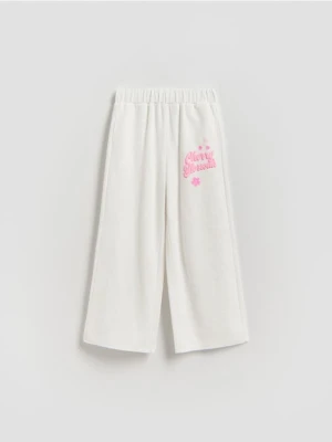Reserved - Spodnie dresowe z nadrukiem - złamana biel
