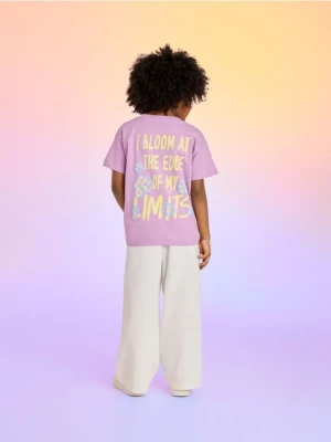 Reserved - Spodnie dresowe z nadrukiem - złamana biel