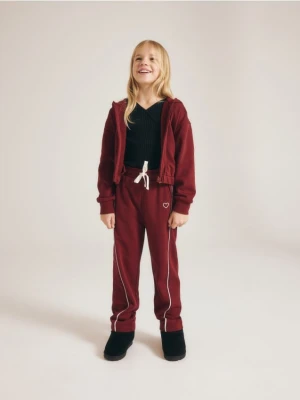Reserved - Spodnie dresowe z przeszyciami - bordowy