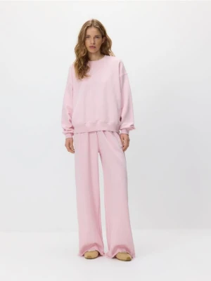 Reserved - Spodnie dresowe z szerokimi nogawkami - pastelowy róż