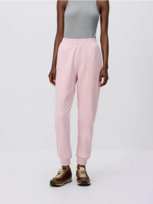 Reserved - Spodnie dresowe ze ściągaczem - pastelowy róż
